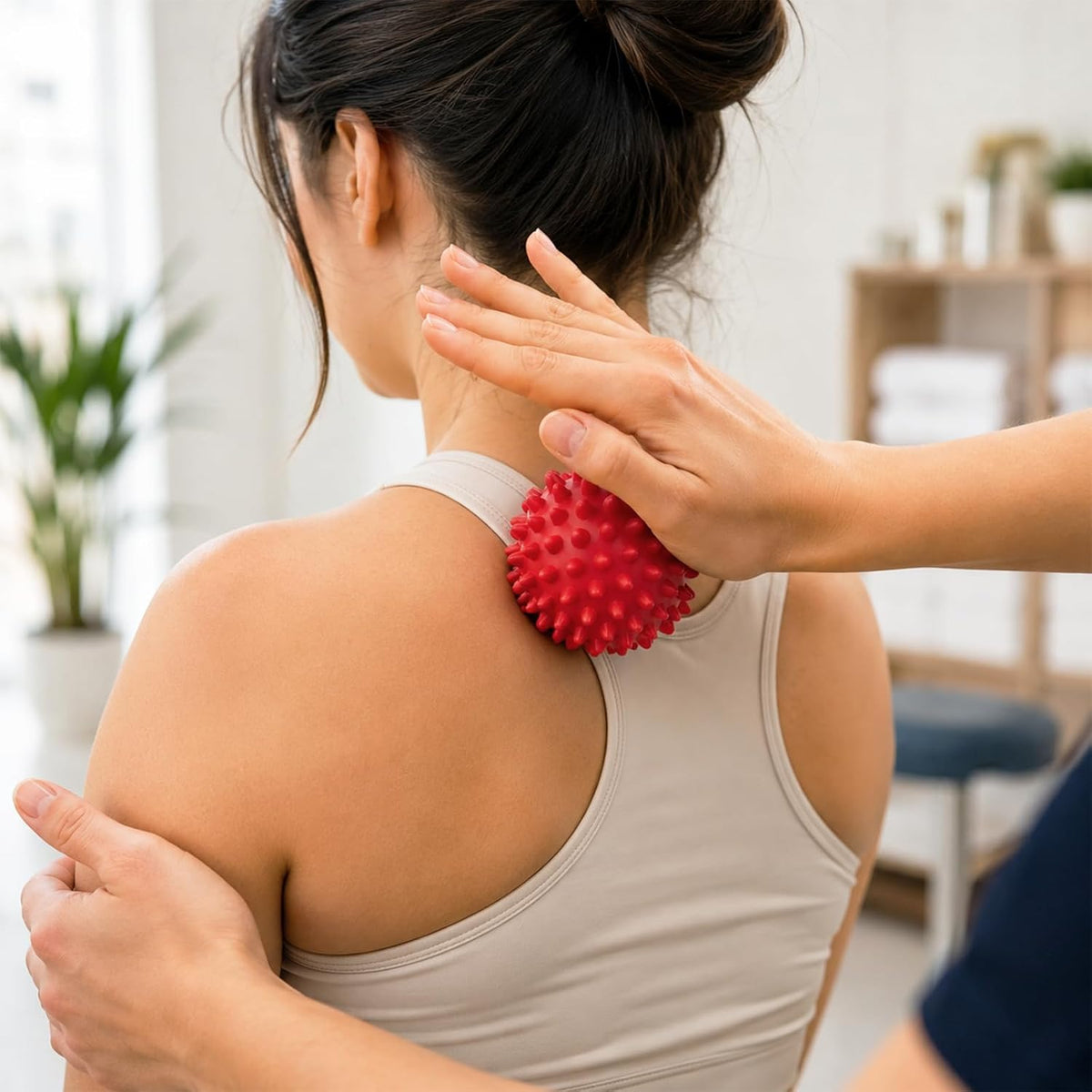 Red spiky ball rolled on the shoulder